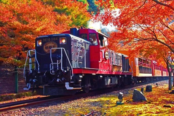 Sagano Romantic Train traveling through the Hozugawa River valley